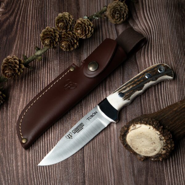 This knife features an 11cm drop point blade and a polished deer antler handle, making it a reliable tool for various outdoor activities.