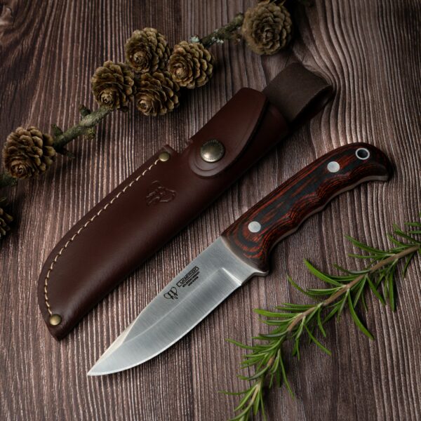 This knife features an 11cm drop point blade and a rose wood handle, making it a reliable tool for various outdoor activities.
