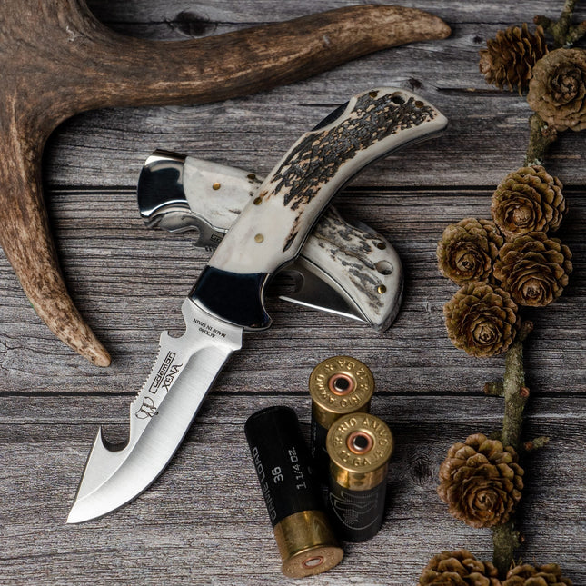 This knife features a 9cm gut hook blade and a polished deer antler handle, making it a reliable tool for various outdoor activities.